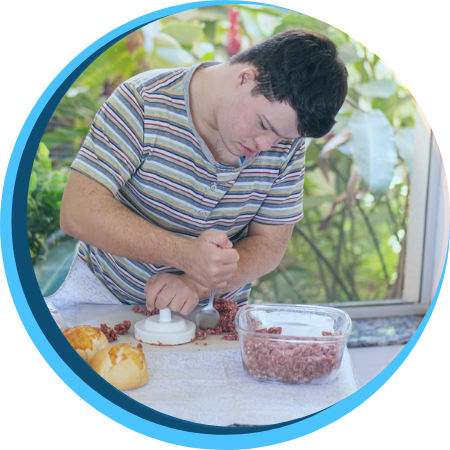 Young Adult with a disability Young Adult with a disability making burgers