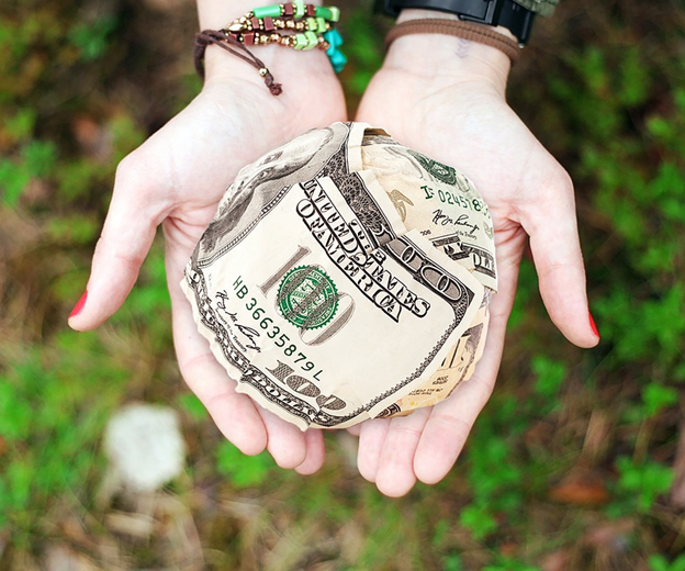 How is Remote Supports Funded A ball of cash sitting in the middle of two palms together