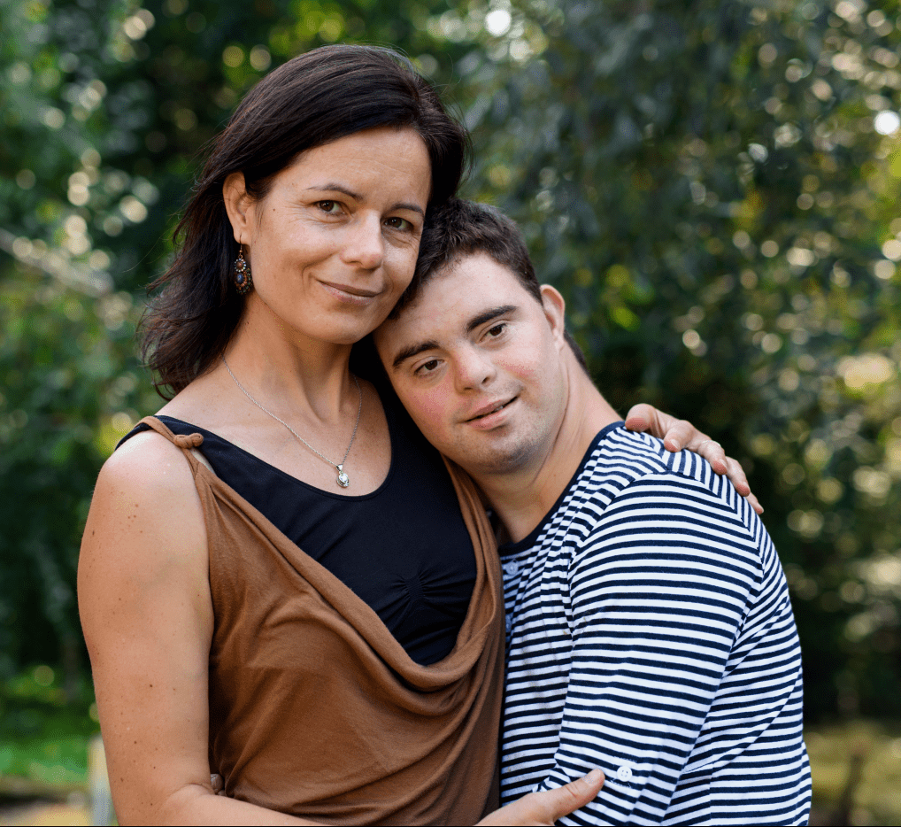 Mom with son who has autism leaning on her shoulder