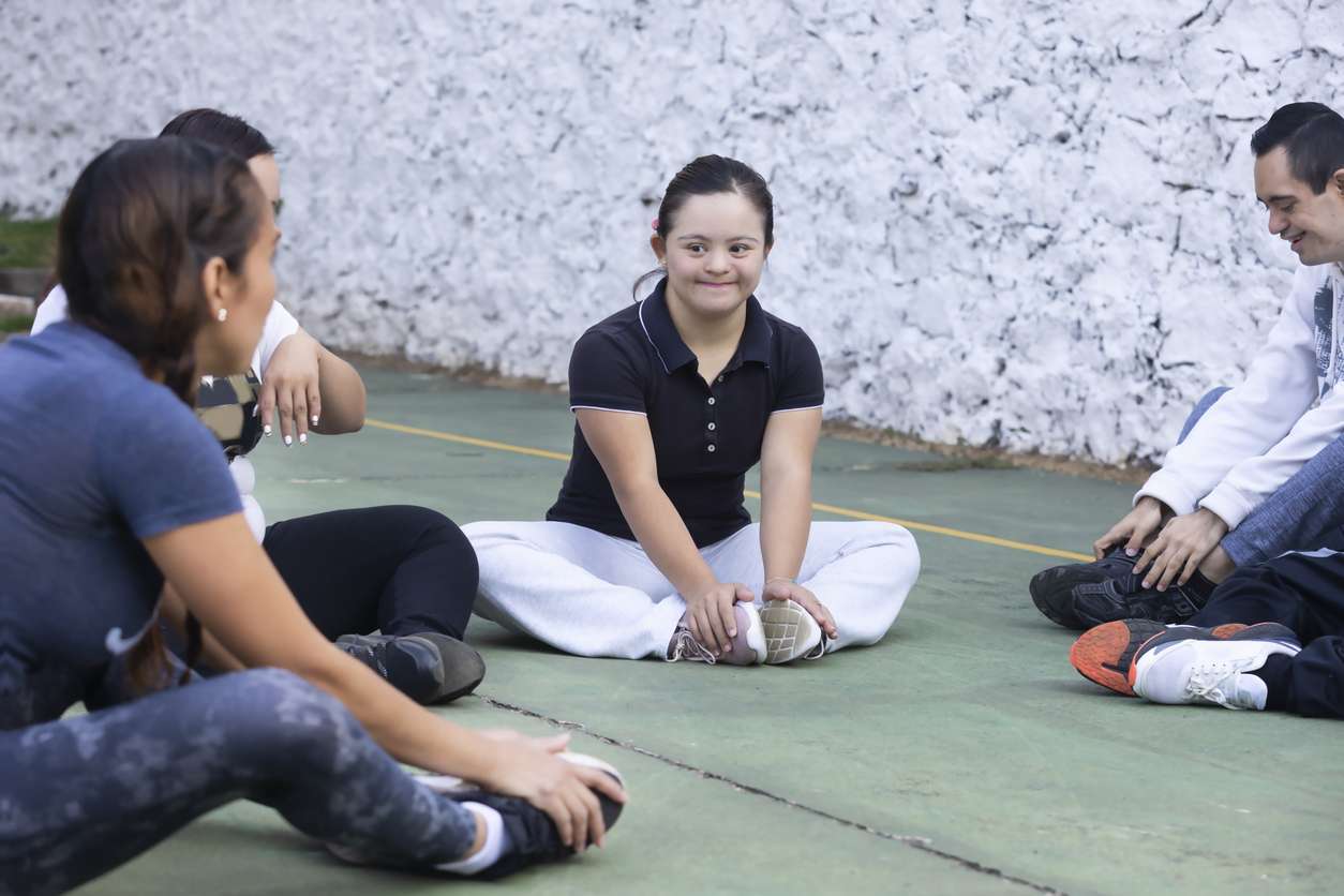 girl with disability sitting in circle