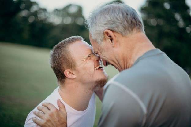 Dan with son who has down syndrome, nose-to-nose
