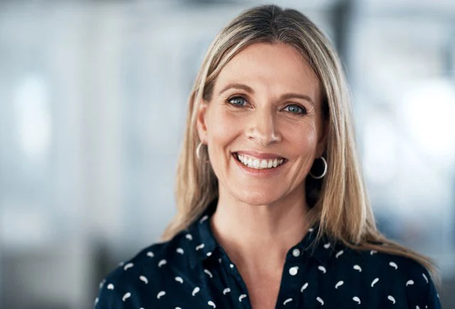Blonde woman smiling at camera